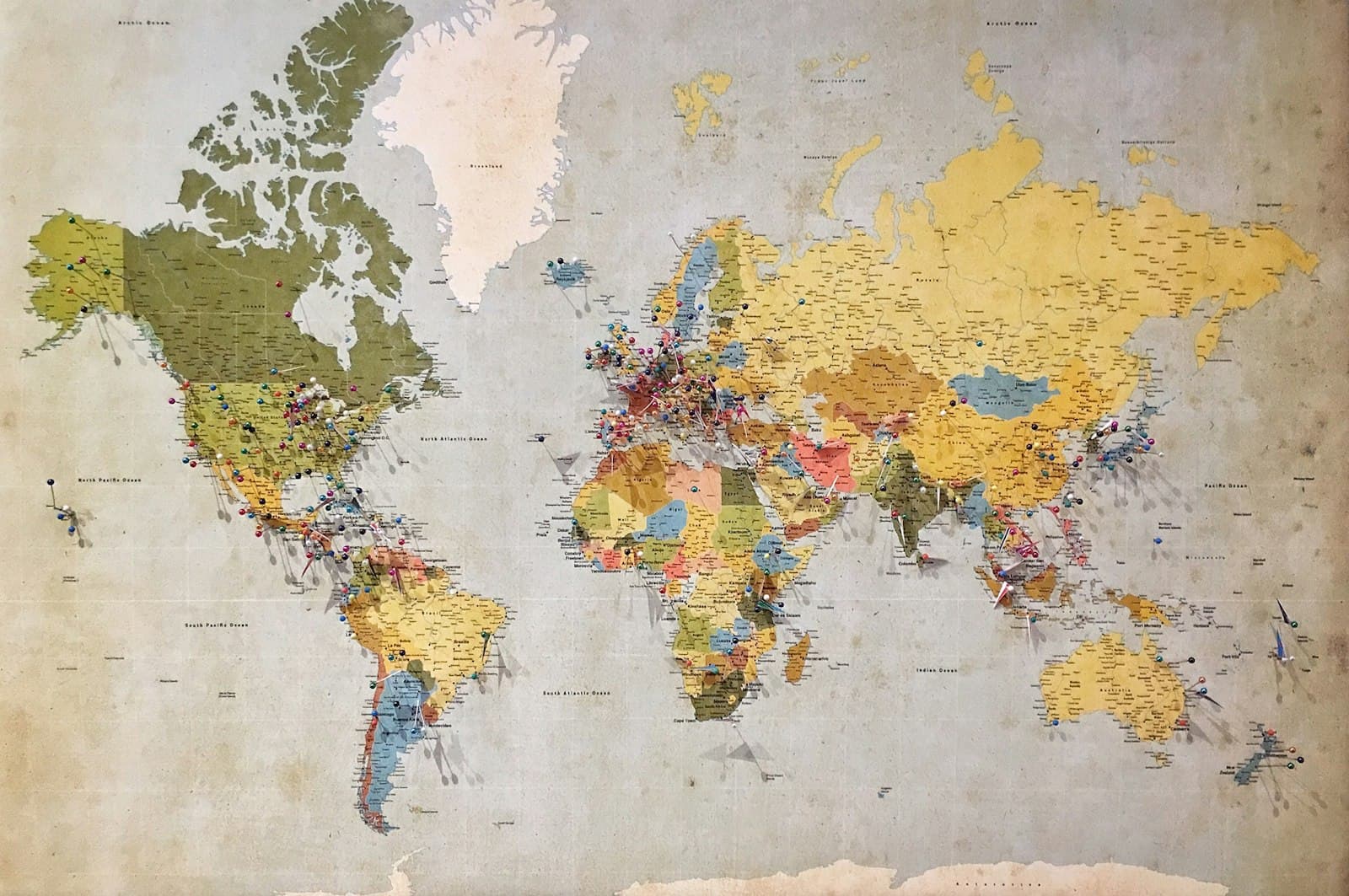 blue, green, and yellow world map — Photo by Andrew Stutesman on Unsplash